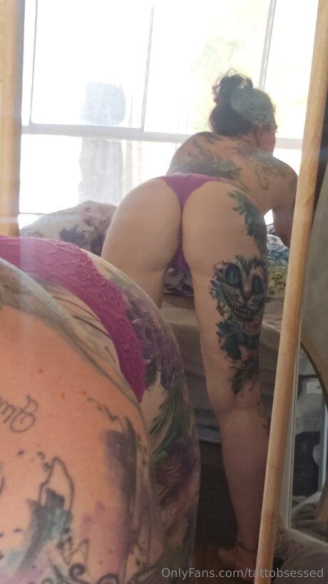 Tattobsessed sexy model photo